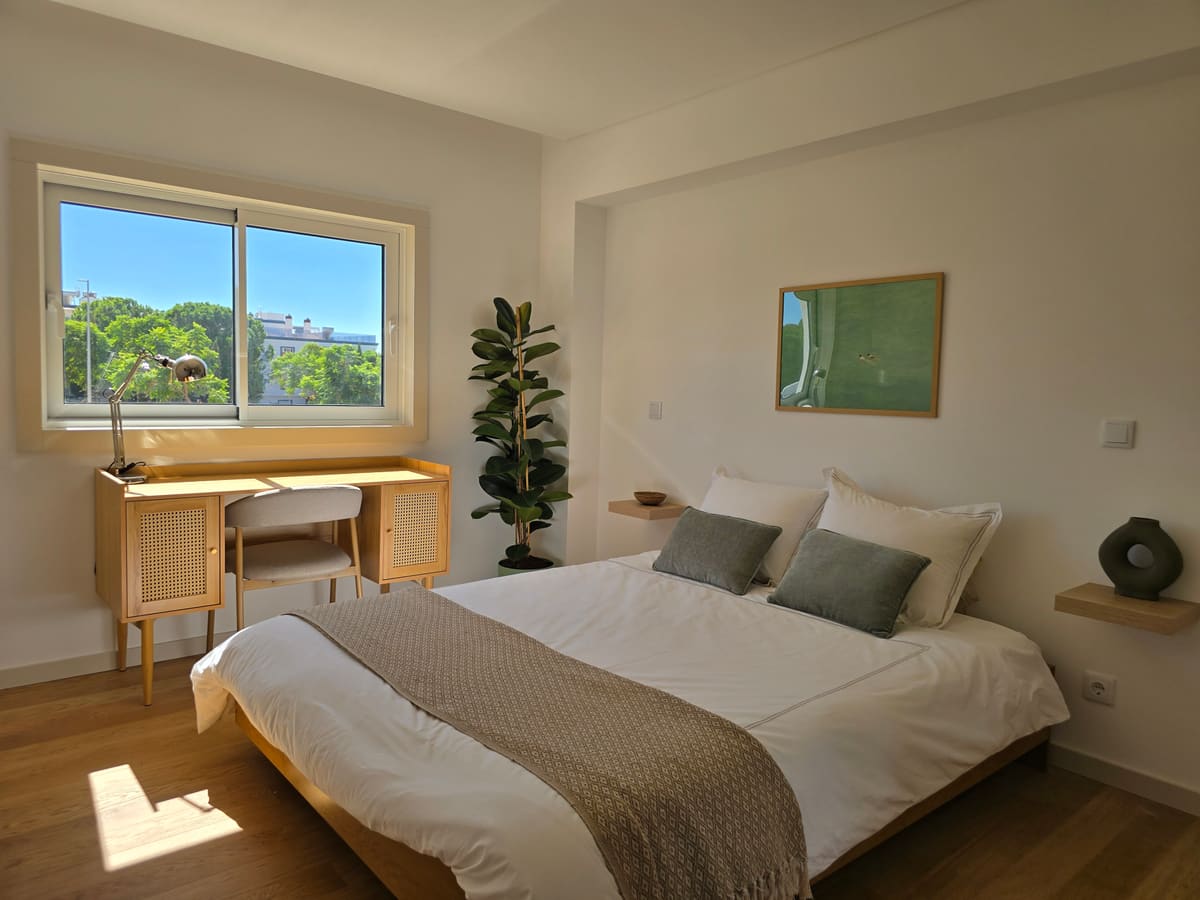 Second bedroom with a queen bed and a desk
